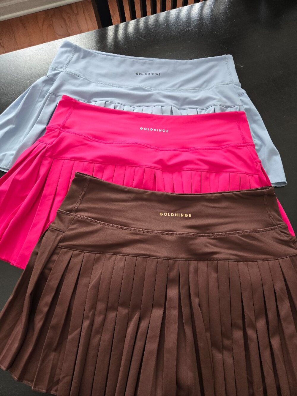 Bundle of three GOLD HINGE plissee skirts in light blue, pink and brown